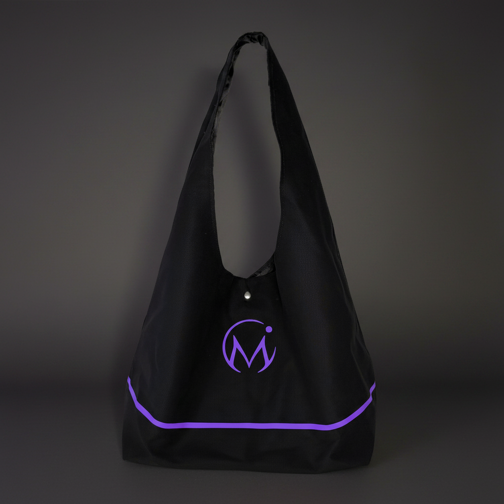 Black tote bag with purple logo on a dark background