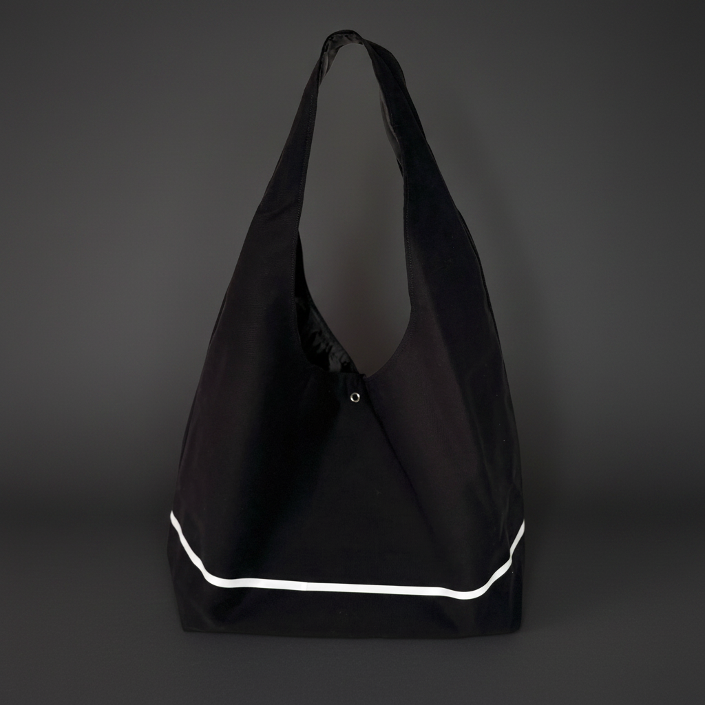 Black bag with white trim on a dark gray background